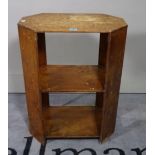 A mid-20th century plywood octagonal three tier open bookcase, 51cm wide x 67cm high.