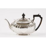 A silver teapot,