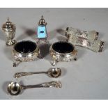 A pair of Victorian silver salts of cauldron form, with blue glass liners,