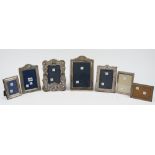 Seven silver mounted rectangular and shaped rectangular photograph frames, in a variety of designs,