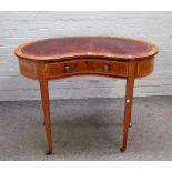 A small 19th century inlaid mahogany kidney shaped writing desk with single frieze drawer on