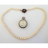 A single row necklace of slightly graduated cultured pearls, on a garnet and cultured pearl clasp,