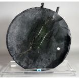 A modern circular black glass abstract sculpture on a perspex base, 46cm diameter x 44cm high, (a.f.