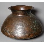 A late 19th century Arts and Crafts hammered copper vase, 33cm wide x 28cm high.