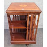 A late 19th century inlaid mahogany square revolving bookcase, 50cm wide x 56cm high.