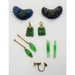 A pair of carved jade pendant drops, the tops detailed 585, two jade batons,