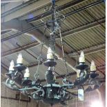 A pair of English wrought iron eight light chandeliers, late 20th century,