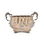 A silver twin handled bowl, the body with spiral fluted, floral,