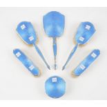 A lady's silver and blue enamelled five piece part dressing set,