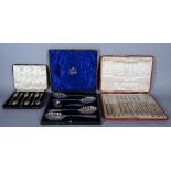 A set of six silver teaspoons, a twelve piece fruit knife and fork set (one knife lacking), cased,