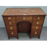 A late George III mahogany kneehole writing desk,