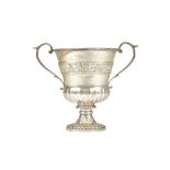 A silver twin handled large cup, of stylized campana form, decorated with fruiting vine to the band,