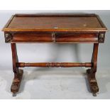 A late Victorian mahogany two drawer writing table with dual ended supports united by turned
