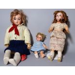 A Simon & Halbig bisque head doll and two further early 20th century bisque head dolls, (3).