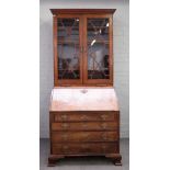 A mid-18th century mahogany bureau bookcase,