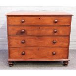 A Victorian mahogany chest of four long graduated drawers, on turned feet, 107cm wide x 91cm high.