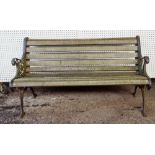 A late Victorian cast iron wooden slatted garden bench with scroll ends, 139cm wide x 78cm high.