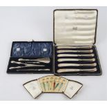 Six silver gilt and varicoloured enamelled cocktail sticks, designed as ladies umbrellas,