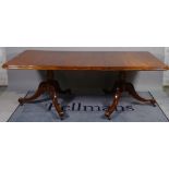 A late Victorian mahogany 'D' end dining table with one extra leaf, on outswept supports,
