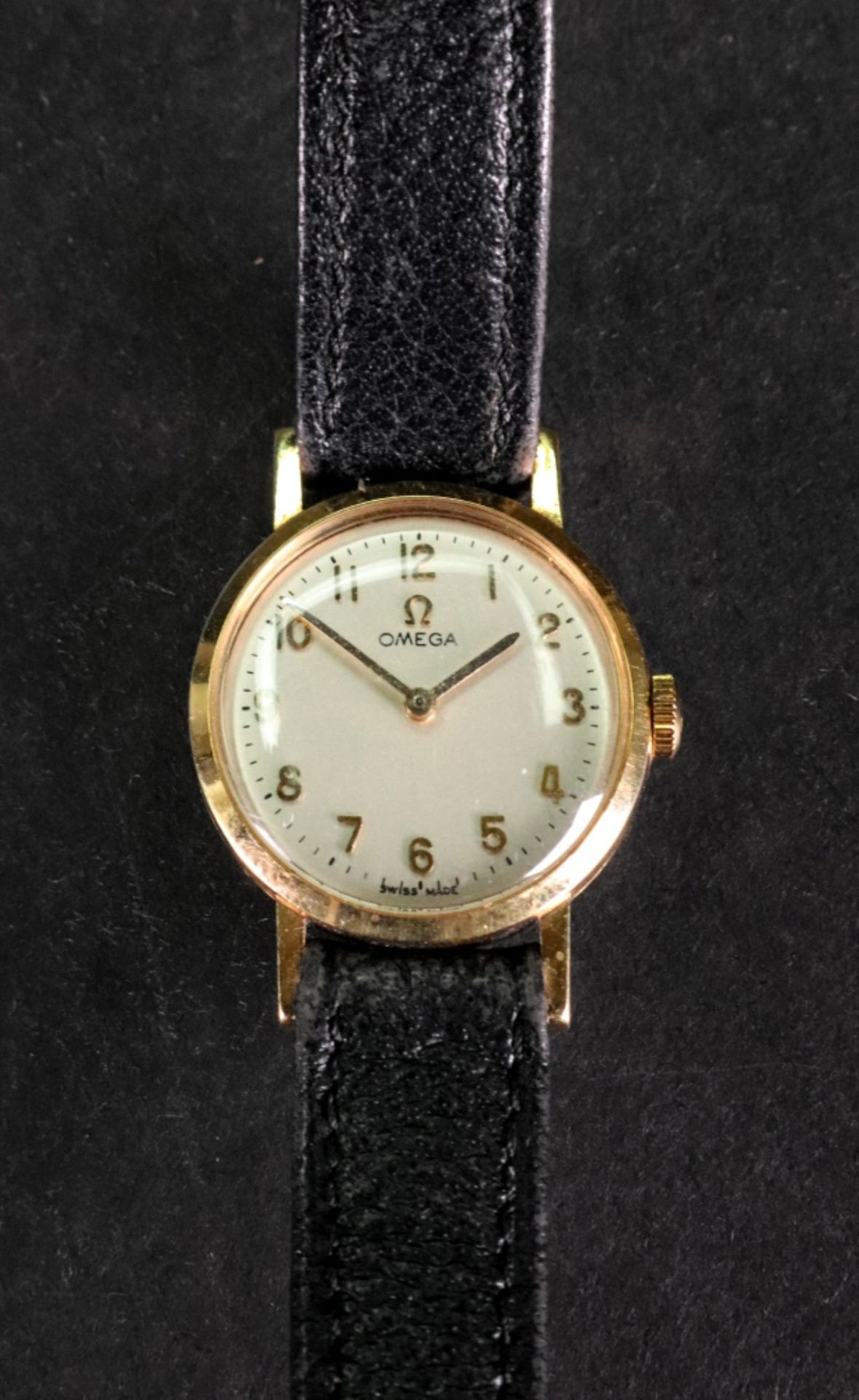 Omega; a lady's 18ct gold wristwatch, the dial with raised gilt Arabic numerals,