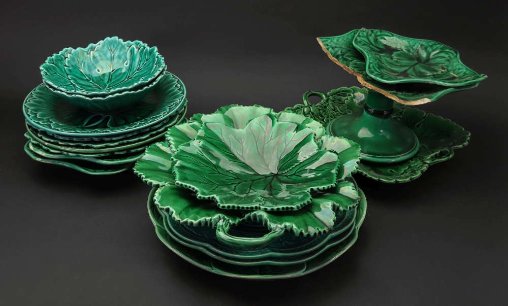 A collection of ten Wedgwood green glazed cabbage leaf moulded plates, dishes and a comport,