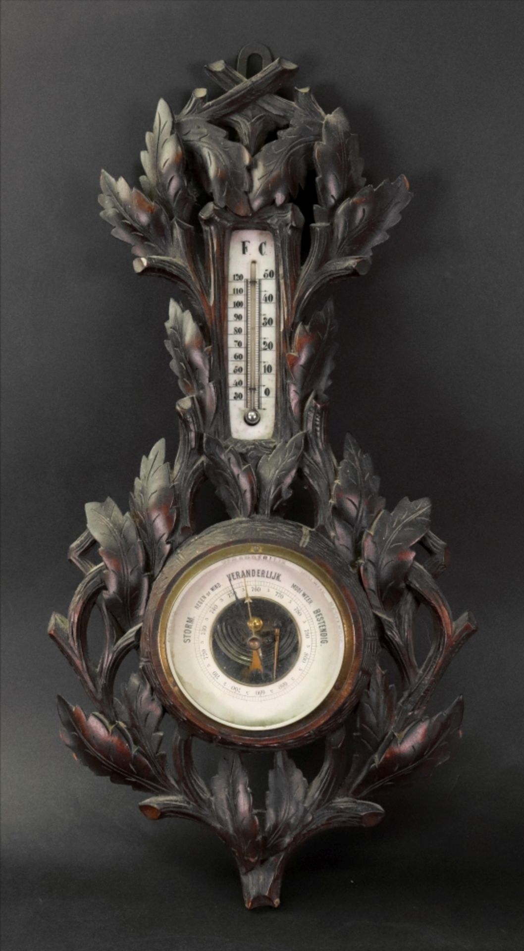 A Black Forest combined barometer and thermometer, circa 1900,