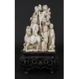 A Chinese ivory group, late 19th/early 20th century,