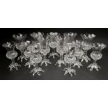 A set of seven glass thistle shape posy vases, late 19th/early 20th century,