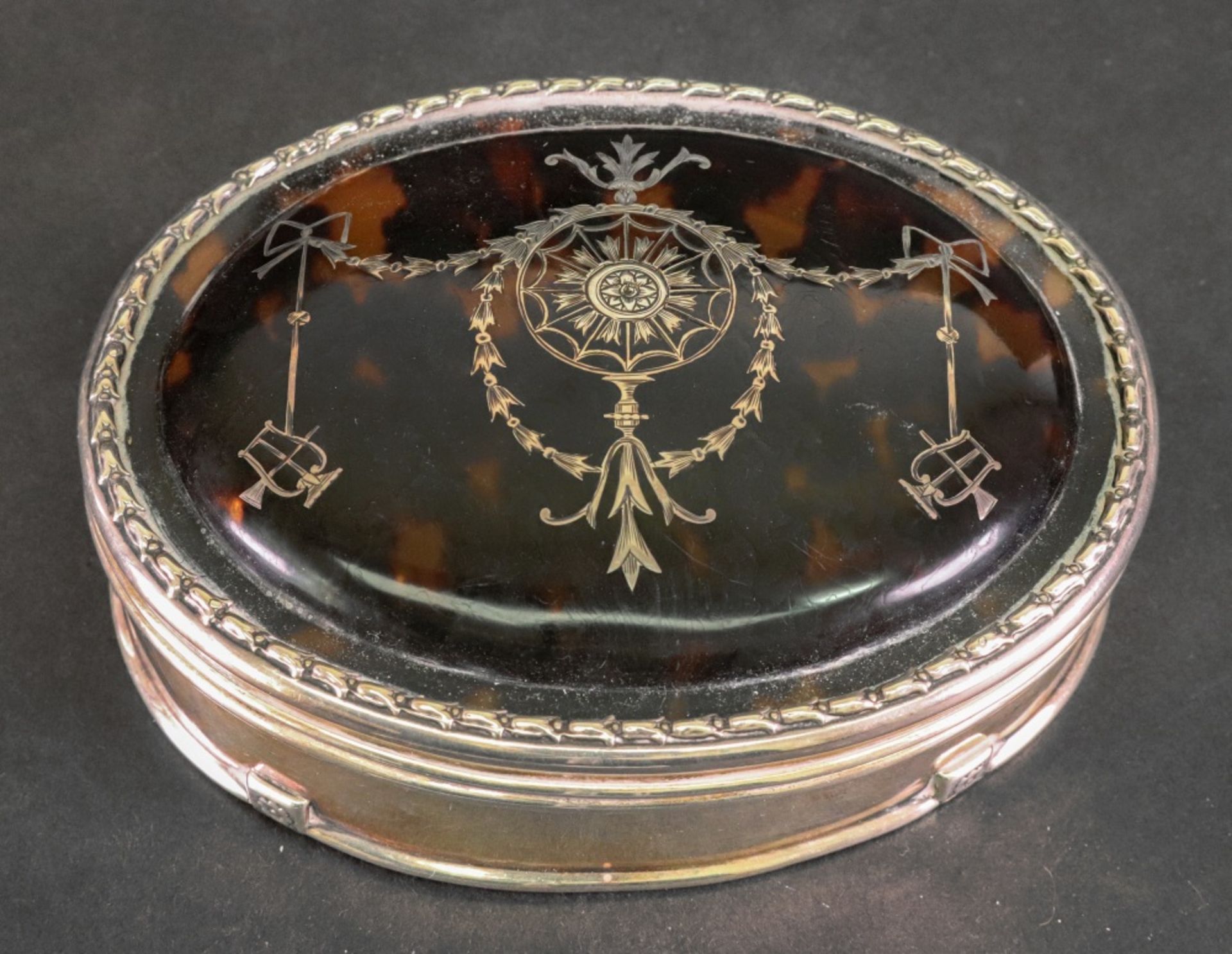 An oval silver mounted tortoiseshell dressing table box, William Comyns, London 1912,