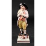 A Staffordshire pearlware figure of a youth, circa 1790,