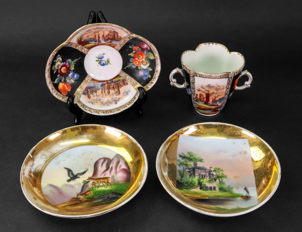 A Dresden quatre lobed two-handled cup and saucer,