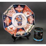 A Japanese octagonal Imari plate, Meiji period, painted with panels of flowers,