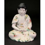 A Japanese Satsuma figure of Amida Nyorai Buddha, Meiji period, modelled seated with hands clasped,