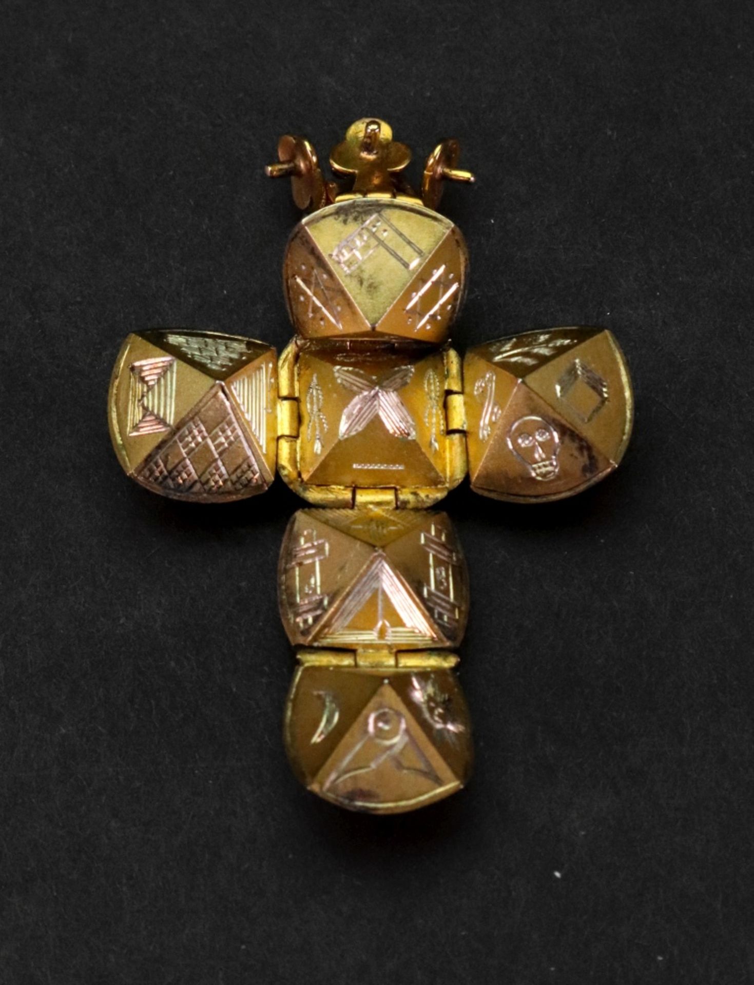 A gold cased Masonic pendant globe, opening to reveal Masonic emblems, marked 9ct, 12.
