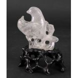 A Chinese rock crystal group of two birds, late 19th/20th century, 9cm high, wood stand.