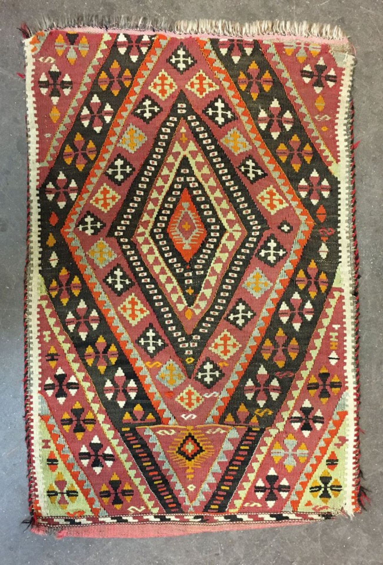 An Afgan Bokhara rug, with two rows of quartered guls on a rust ground, 176 x 125cm, - Image 3 of 3