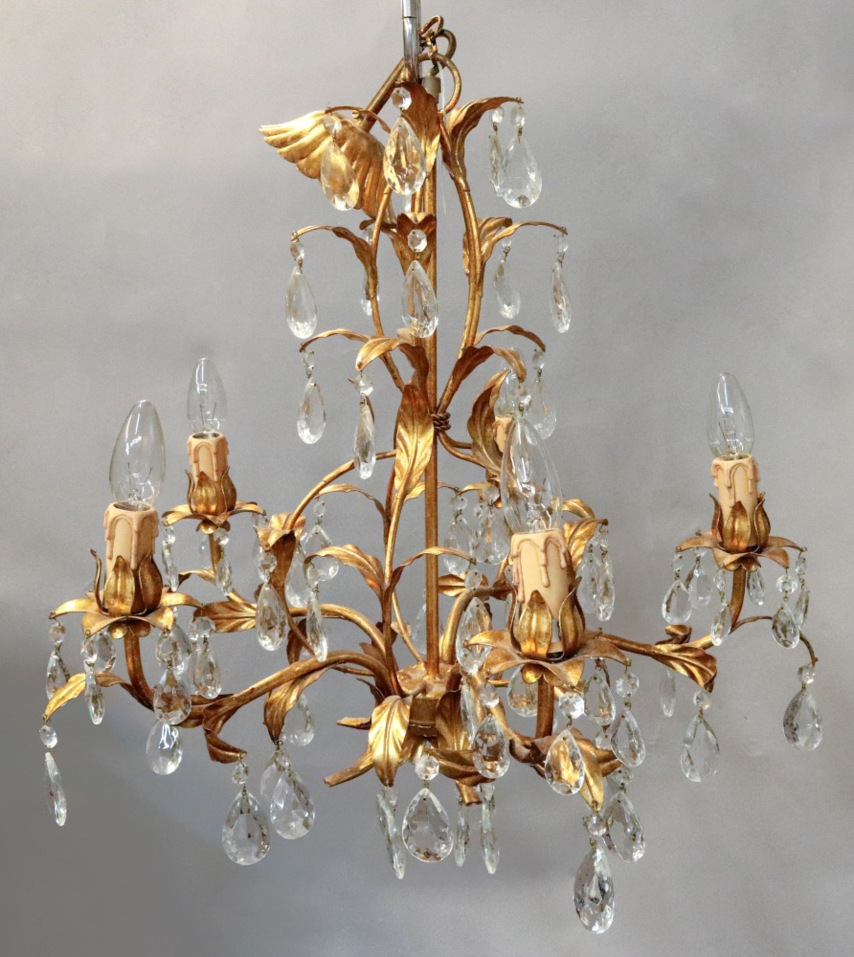 A pair of Christopher Wray five light gilt metal and facet cut glass chandeliers,