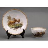 A Meissen teacup and saucer, circa 1760-70, each painted with two sheep in a landscape,