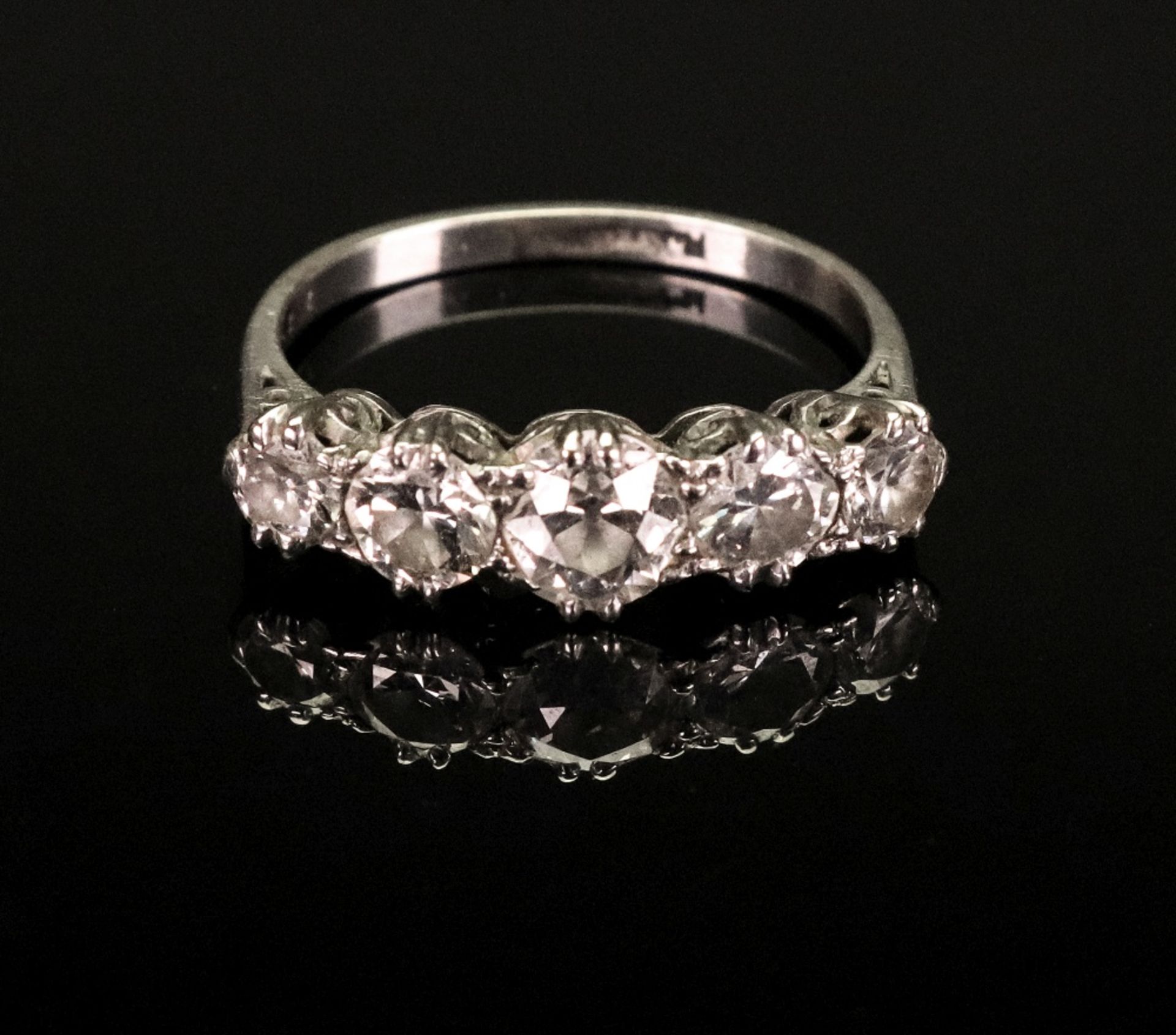 A platinum five-stone diamond ring, the circular-cut diamonds approximate total diamond weight 2.