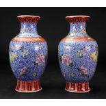 A pair of Chinese famille rose baluster vases, Qianlong seal mark, but later,
