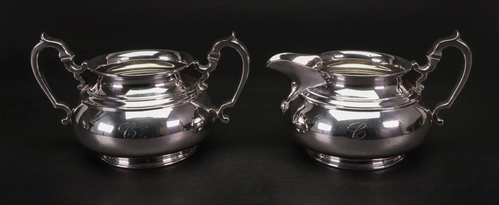 A mid 18th century style compressed baluster shape silver sugar basin and milk jug,