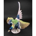 A modern Portuguese porcelain figure of a bird with wings outstretched, 37.5cm high.