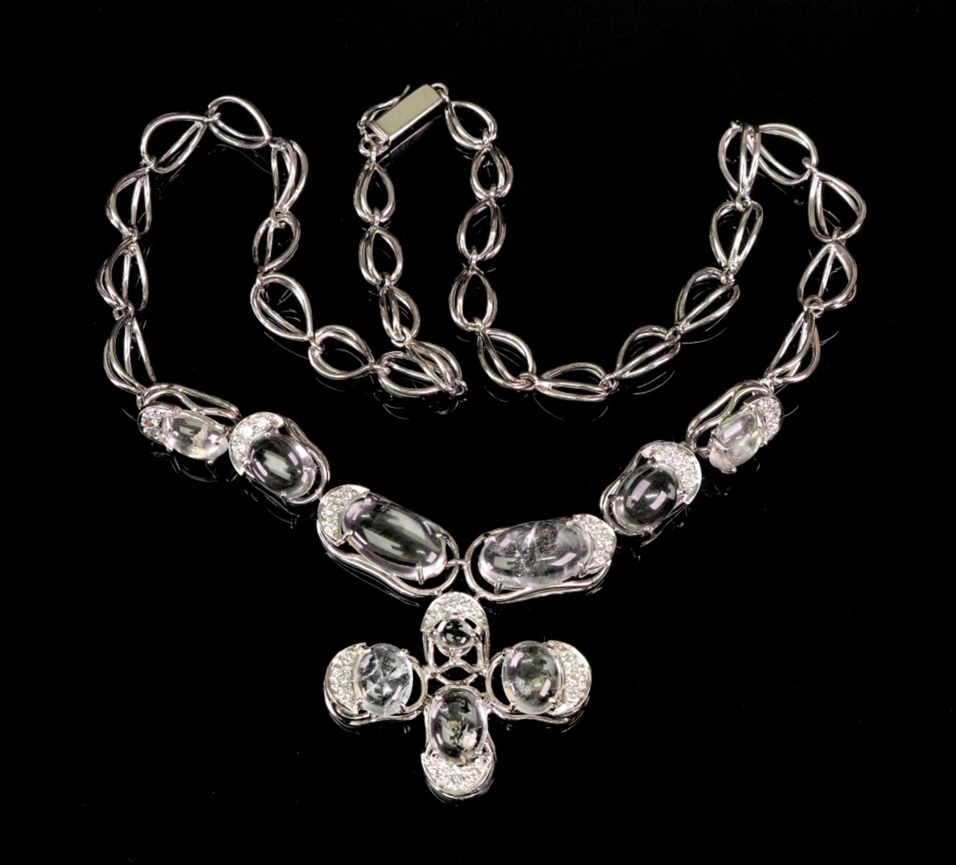 An 18ct white gold, white topaz and diamond set necklace, the clasp hallmarked, London, 54g gross.