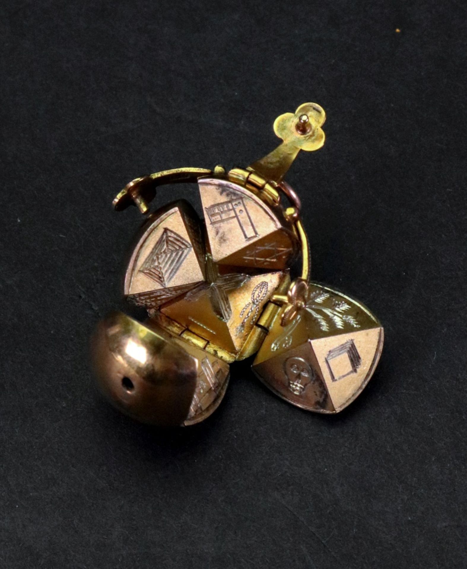 A gold cased Masonic pendant globe, opening to reveal Masonic emblems, marked 9ct, 12. - Image 2 of 3