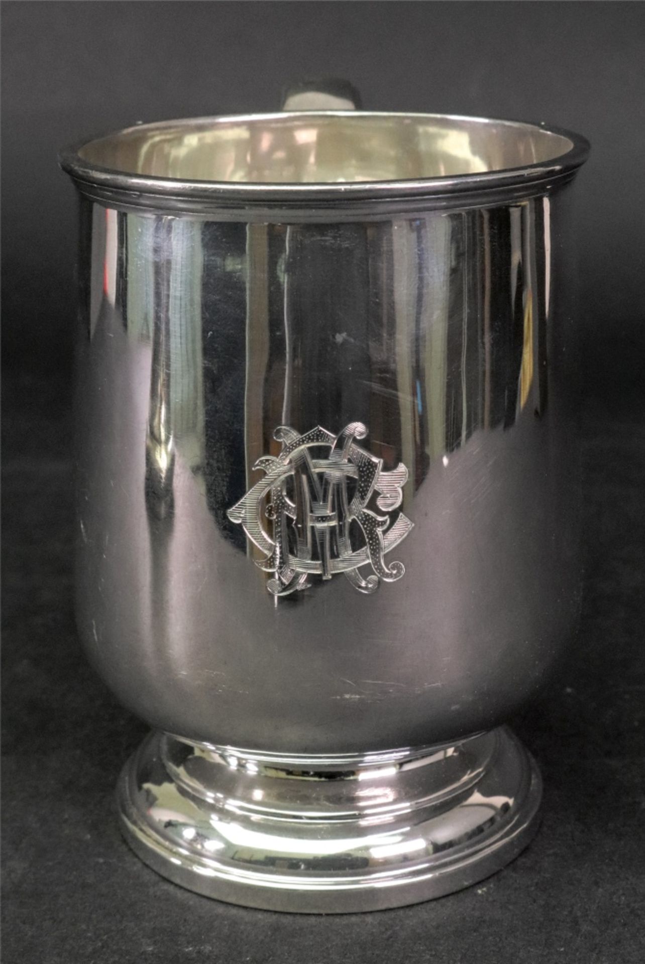 A George II style silver pint mug, Walker & Hall, Sheffield 1922, 10ozs, monogrammed, 12.5cm high.