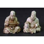 Two Japanese ivory figures of scholars, Meiji period, each carved seated, one holding a scroll,