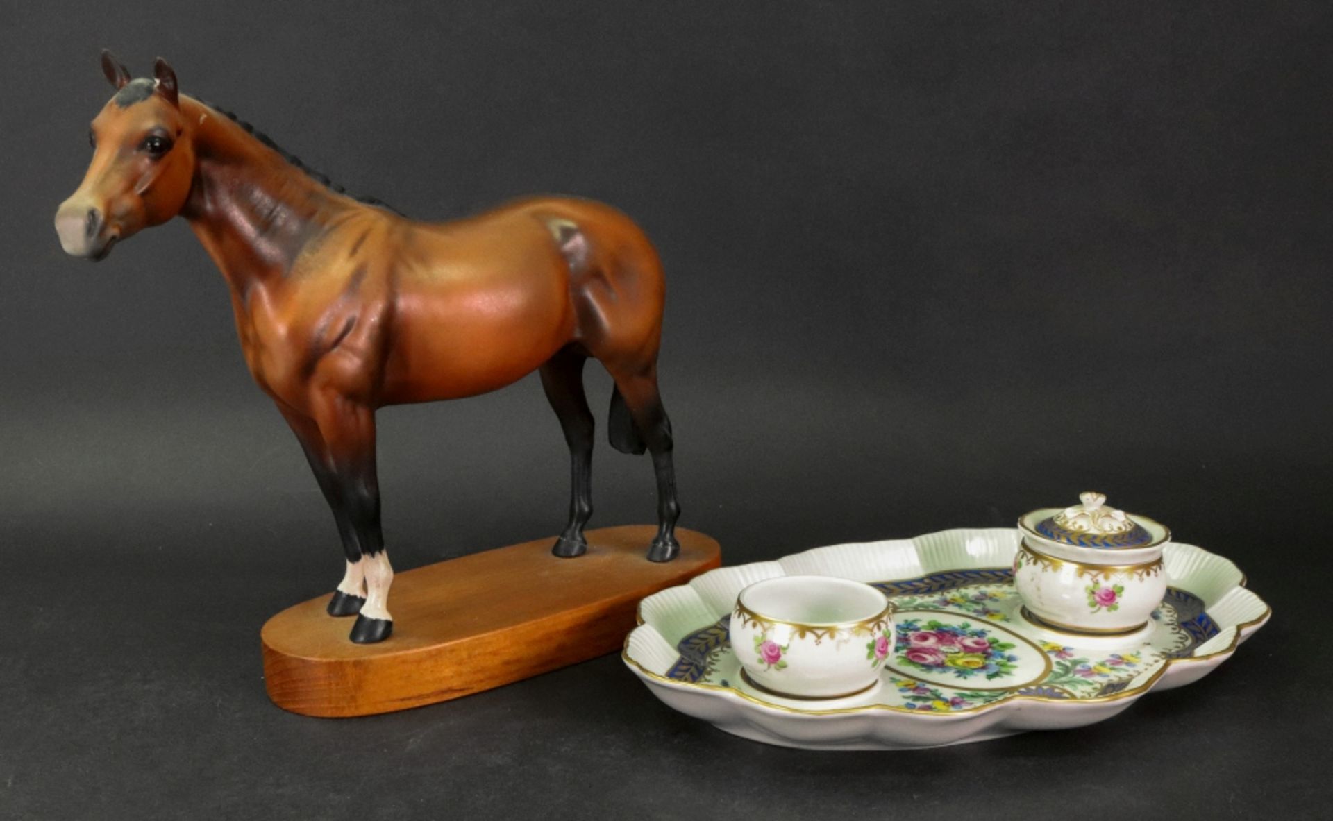 A Beswick figure of a Thoroughbred stallion, standing on an oval wooden plinth base, 22.