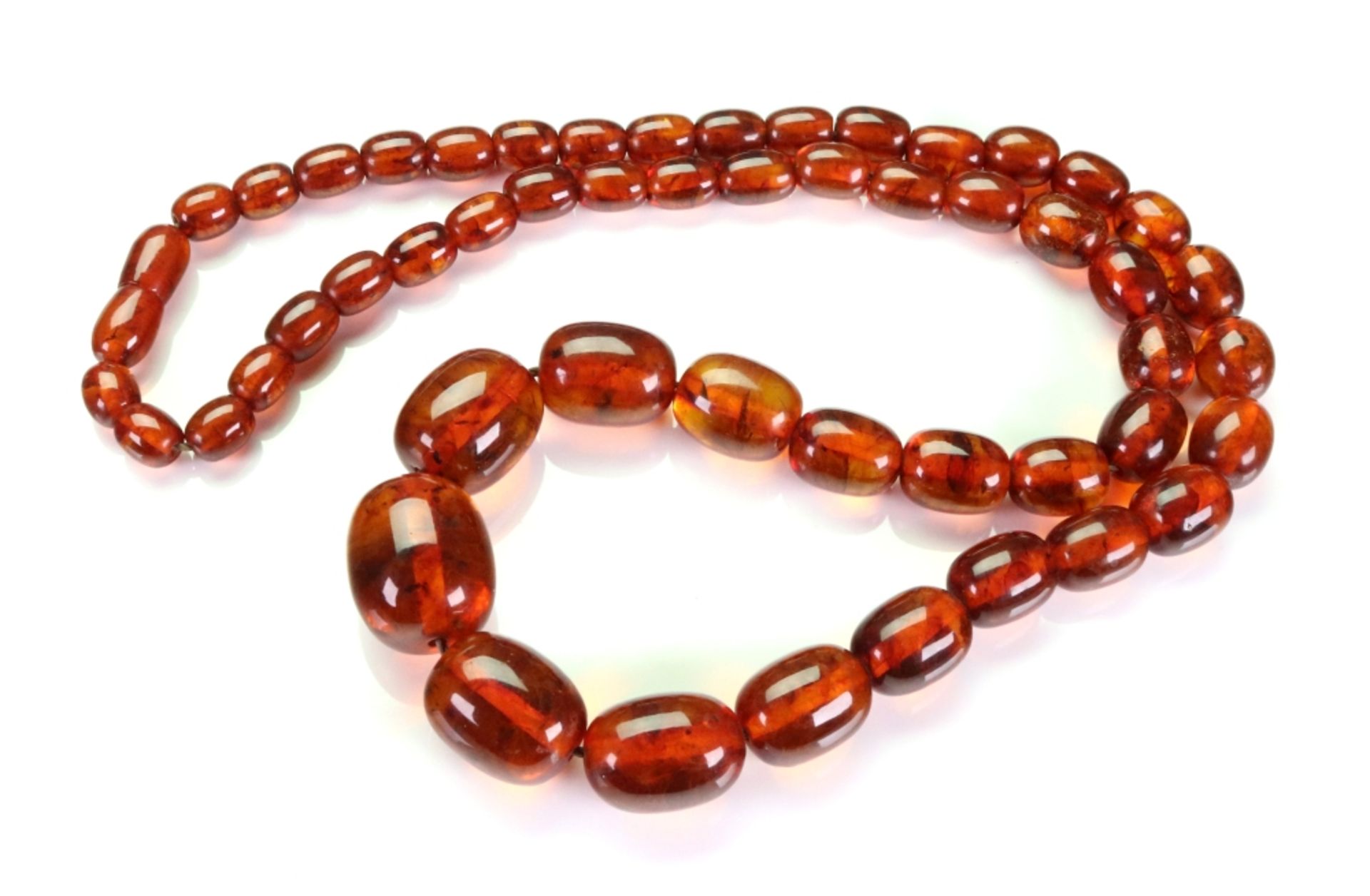 A single row amber bead necklace of graduated design, the beads measuring approximately 17. - Image 2 of 2