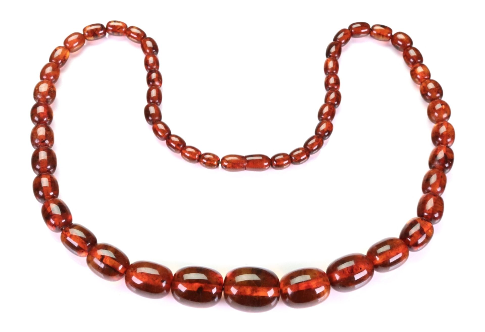 A single row amber bead necklace of graduated design, the beads measuring approximately 17.