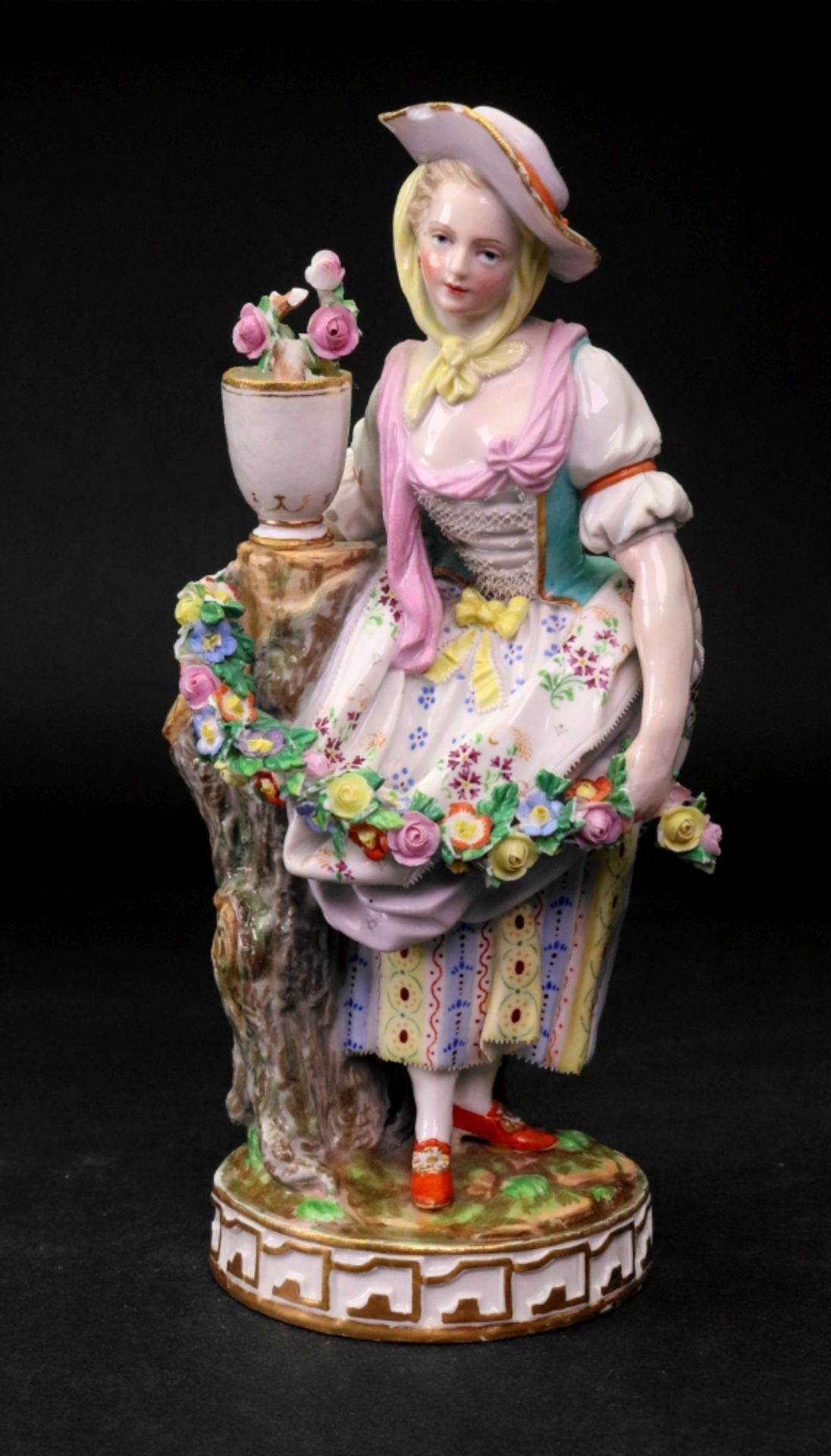 A Meissen figure of a young lady, 19th century,